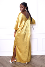 Load image into Gallery viewer, Woman wearing a gold caftan dress
