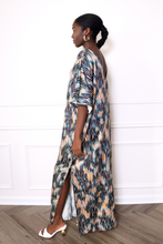 Load image into Gallery viewer, woman wearing a zebra print caftan dress
