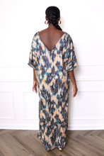 Load image into Gallery viewer, woman wearing a zebra print caftan dress
