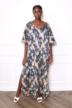 Load image into Gallery viewer, woman wearing a zebra print caftan dress
