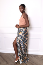 Load image into Gallery viewer, woman wearing a large zebra print scarf as a skirt
